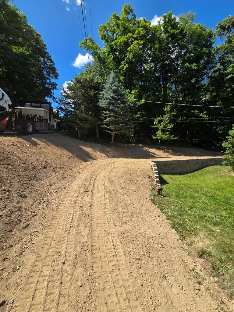 After: freshly regraded gravel driveway with improved drainage along the edge, Sussex County NJ
