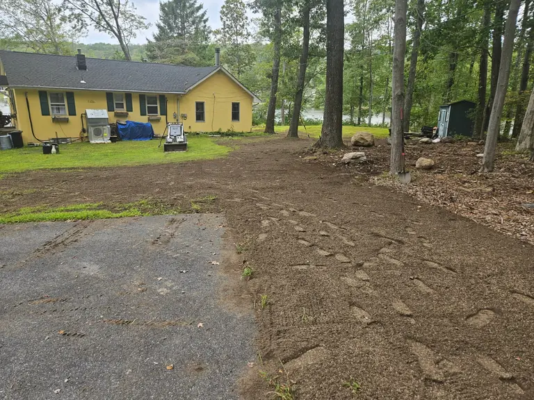 Before: bare regraded yard ready for lawn restoration after excavation work in Sussex County NJ